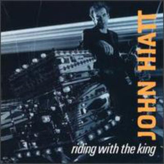 the album cover for John Hiatt - Riding with the King