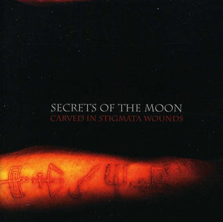 the album cover for Secrets Of The Moon - Carved in Stigmata Wounds