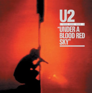 the album cover for U2 - Under A Blood Red Sky