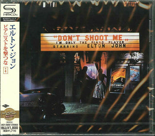 the album cover for Elton John - Don't Shoot Me I'm Only Piano Player