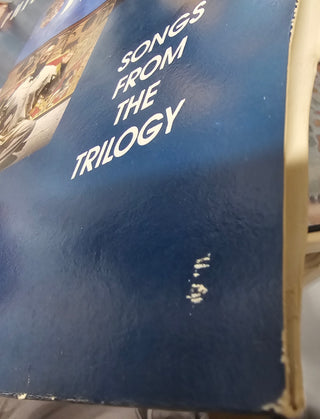 Philip Glass- Songs From The Trilogy (1989 UK Press)(Surface Mark Side 1 Track 1, Water Damage To Sleeve) (Used Vinyl)