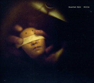 the album cover for Gauntlet Hair - Stills