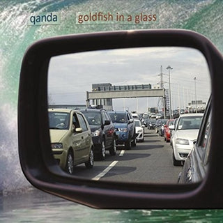 the album cover for Qanda - Goldfish In A Glass