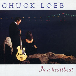 the album cover for Chuck Loeb - In a Heartbeat