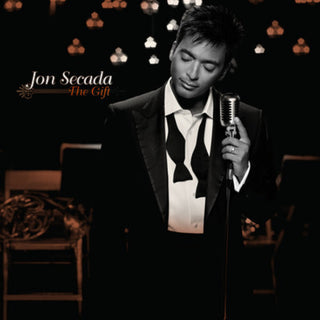 the album cover for Jon Secada - The Gift