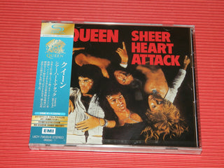 the album cover for Queen - Sheer Heart Attack [Deluxe] [Remastered] [Reissue] (Shm) (Jpn)