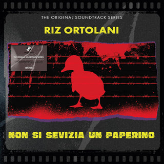 the album cover for Riz Ortolani  (W/Cd) (Colv) (Ltd) (Ogv) (Red) (Ita) - Non Si Sevizia Un Paperino (W/Cd) [Colored Vinyl] [Limited Edition]