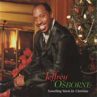 the album cover for Jeffrey Osborne - Something Warm For Christmas [Colored Vinyl] (Grn) [Limited Edition]