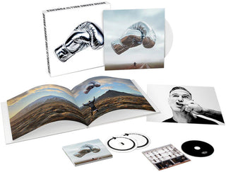 the album cover for Bryan Adams - Roll With The Punches: Deluxe (Box) [Colored Vinyl] [Deluxe]