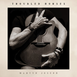 the album cover for Martyn Joseph - Troubled Horses
