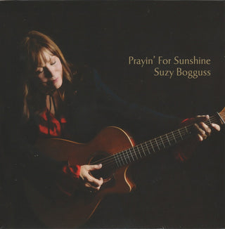 the album cover for Suzy Bogguss - Prayin' For Sunshine