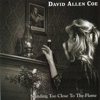 the album cover for David Allan Coe - Standing Too Close To the Flame