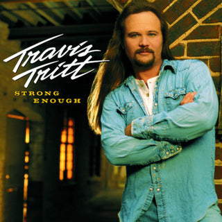 the album cover for Travis Tritt - Strong Enough