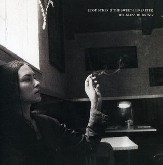 the album cover for Jesse Sykes & The Sweet Hereafter - Reckless Burning