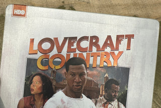 Lovecraft Country (Steelbook, Light Crease Along Top Of Steelbook)