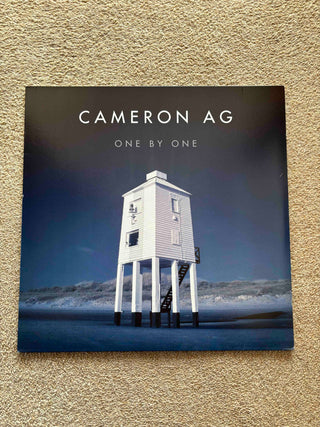 Cameron Ag- One By One